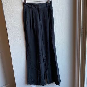 The Row Lightweight Black Pleat-Front Trousers